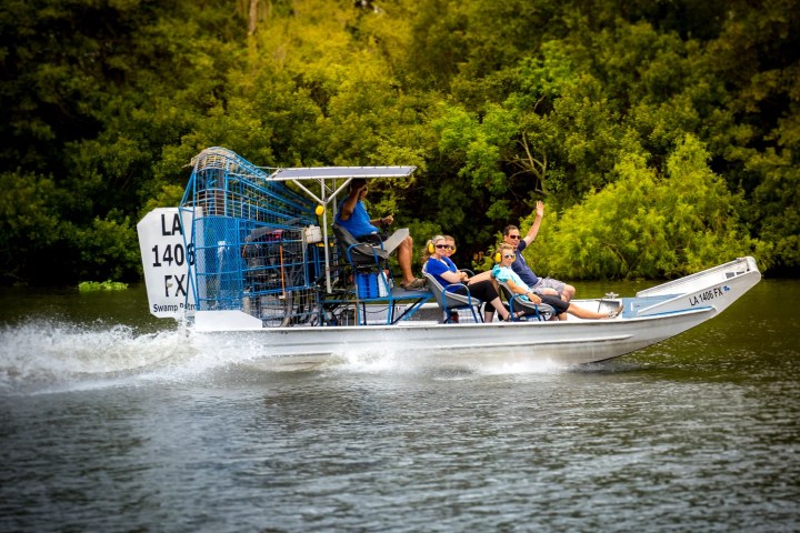 a group of people riding on the back of a boat